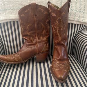 Woman’s brown leather boots.